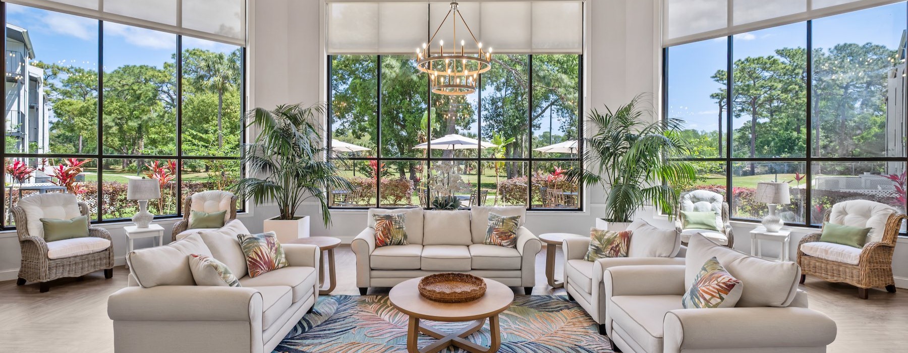 lounge with seating tables and large windows