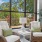 lounge area with seating table lamp and windows