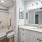bathroom with sink mirror toilet and shower