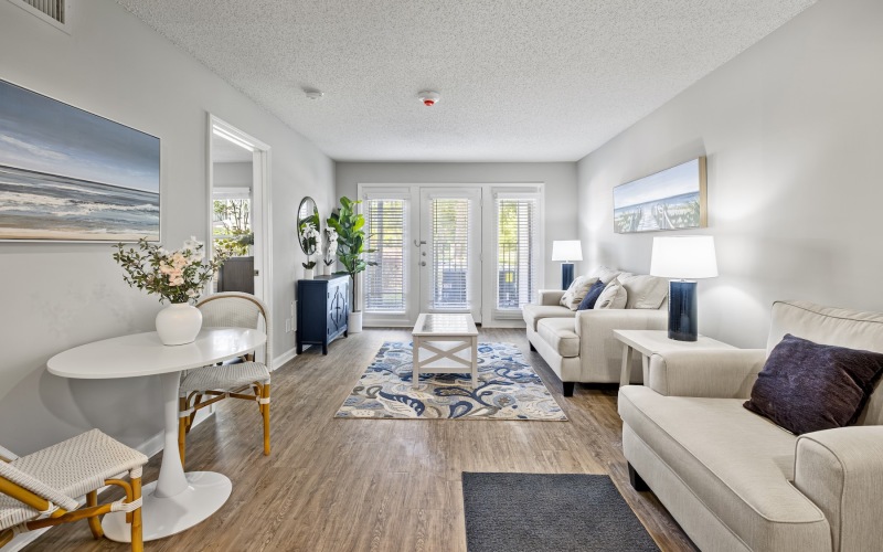 living room with couch coffee table and windows