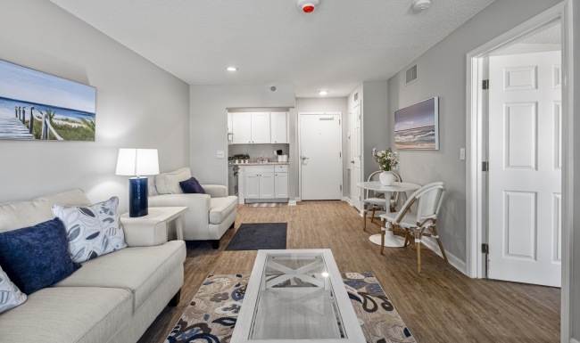 Spacious living areas to recline and recharge living room with a couch and coffee table