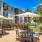 outdoor patio with table seating and umbrellas