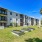 multilevel building with trees and grass
