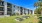multilevel building with trees and grass