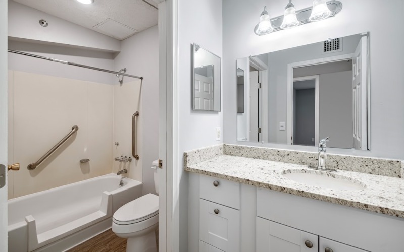 Spacious bathrooms with everything you need well lit bathroom